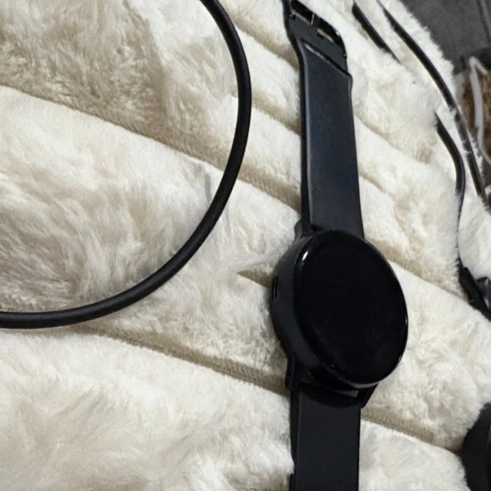 Samsung Black Smartwatch with Charging Cable